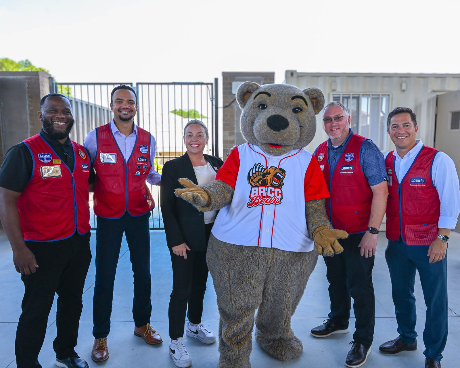 Lowe's representatives, Provost Sarah Barlow and BRCC mascot Maxwell at the Capital City Construction Lab celebration